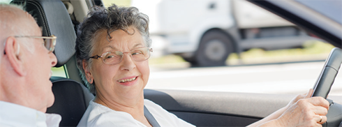 2 older people in a car